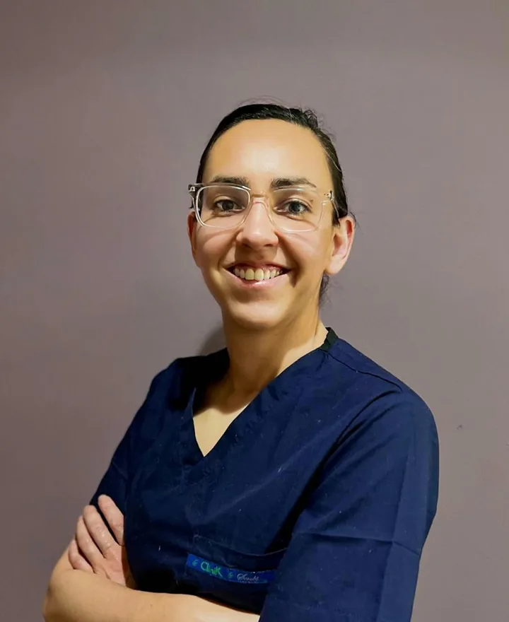Portrait of Tasha, dental assistant, in navy scrubs